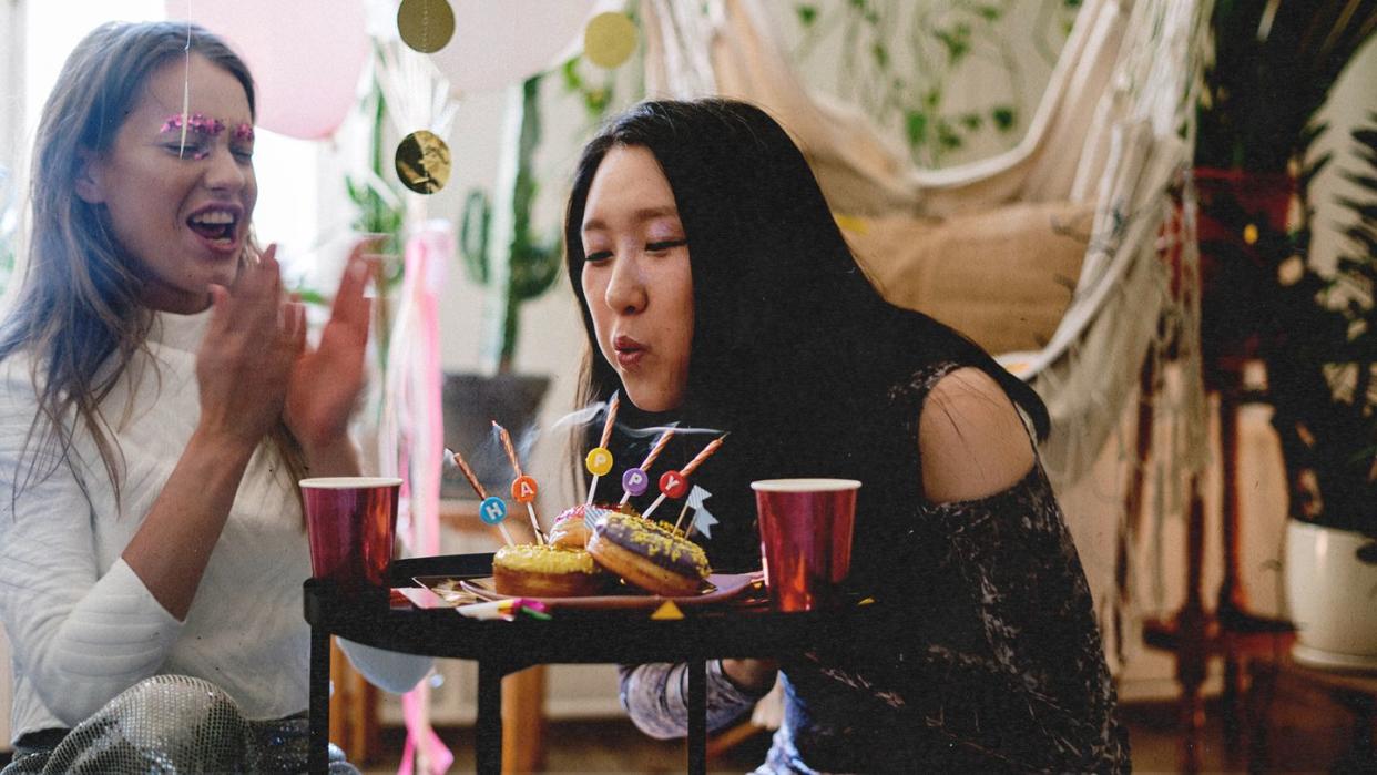 a woman holding a cake