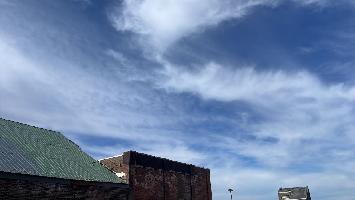 Blue skies with clouds rolling in over downtown Binghamton Monday morning, April 8, 2024.