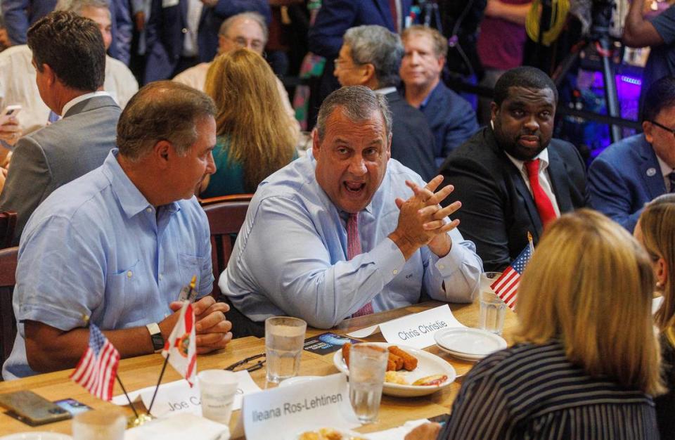 Republican presidential candidate Chris Christie, chats with attendees to a town hall meeting at Casa Cuba restaurant in South Miami, on Friday, Aug.18, 2023.