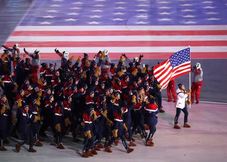 Pyeongchang 2018 Winter Olympics – Opening Ceremony – Pyeongchang Olympic Stadium- Pyeongchang, South Korea – February 9, 2018 - Erin Hamlin of U.S. carries the national flag during the opening ceremony. REUTERS/Phil Noble