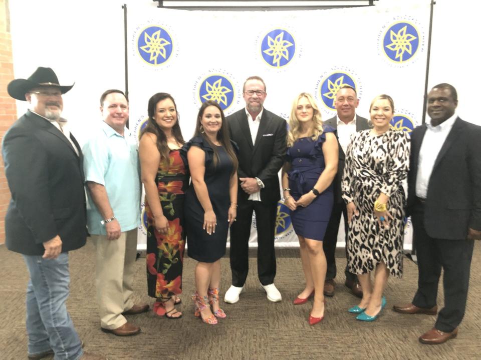 Hall of Famer and former Astros first baseman Jeff Bagwell takes a photo with members of the Children's Advocacy Center of the Coastal Bend during the second-annual Garden of Hope Gala at the Solomon Ortiz Center in downtown Corpus Christi.