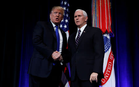 U.S. President Donald Trump talks with Vice President Mike Pence as he arrives at the Missile Defense Review announcement at the Pentagon in Arlington, Virginia, U.S., January 17, 2019. REUTERS/Kevin Lamarque