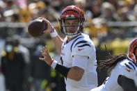Cincinnati Bengals quarterback Joe Burrow (9) looks to pass against the Pittsburgh Steelers during the first half an NFL football game, Sunday, Sept. 26, 2021, in Pittsburgh. (AP Photo/Don Wright)