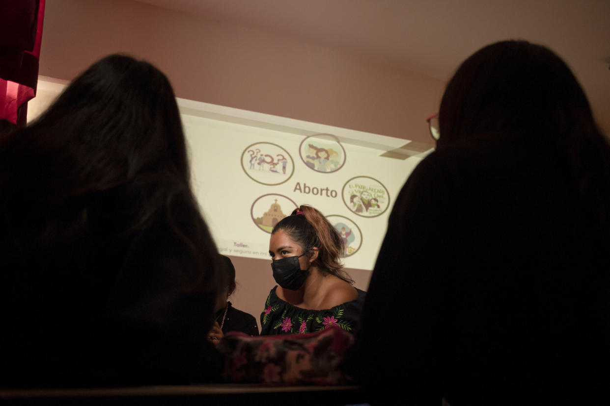 Students attend a class on abortion rights at a sex education fair in Oaxaca, Mexico, Friday, Oct. 14, 2022. In 2019, Oaxaca was among the earliest states to decriminalize abortion. It has become a prime example of the complexities facing Mexico as it confronts the issue. (AP Photo/Maria Alferez)