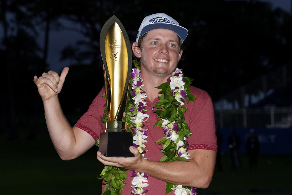 Cameron Smith holds the champions trophy after the final round of the Sony Open PGA Tour golf event, Sunday, Jan. 12, 2020, at Waialae Country Club in Honolulu. (AP Photo/Matt York)