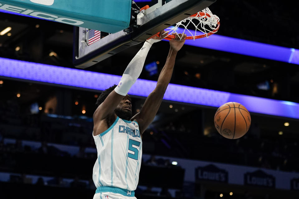 Charlotte Hornets center Mark Williams dunks the ball in the first half of an NBA basketball preseason game against the Oklahoma City Thunder, Sunday, Oct. 15, 2023, in Charlotte, N.C. (AP Photo/Erik Verduzco)