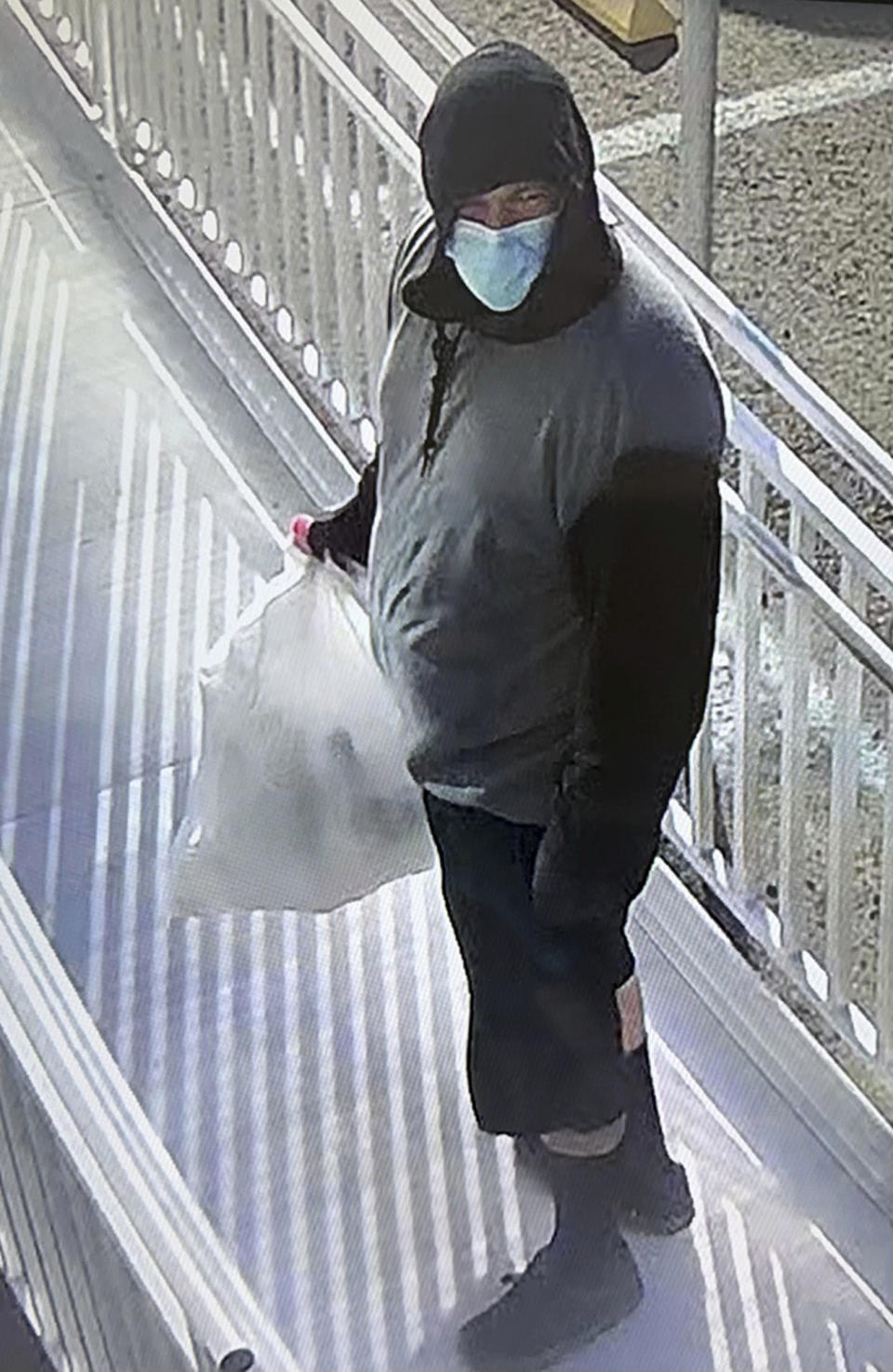 This surveillance image provided by Merced County Sheriff's Office shows a possible suspect sought by authorities in the kidnapping of four members of a family, including an 8-month-old child. Deputies are searching Merced and surrounding areas for the baby, Aroohi Dheri; the child’s mother, Jasleen Kaur, father Jasdeep Singh, and uncle Amandeep Singh, who were taken against their will at gunpoint from a business in the city of Merced, Calif. on Monday, Oct. 3, 2022. (Merced County Sheriff's Office via AP)