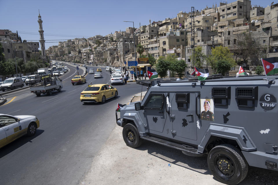 A poster with picture of Crown Prince Hussein is pasted at a Jordanian security patrol that is deployed in preparation for the upcoming royal wedding, in Amman, Jordan, Wednesday, May 31, 2023. Crown Prince Hussein and Saudi architect Rajwa Alseif are to be married on Thursday at a palace wedding in Jordan, a Western-allied monarchy that has been a bastion of stability for decades as Middle East turmoil has lapped at its borders.(AP Photo/Nasser Nasser)