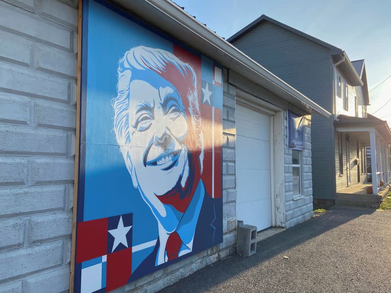 A mural of a smiling U.S. President Donald Trump commissioned by Randy Bunch, a commissioner in Fulton County, is seen on the side of a business on Election Day in McConnellsburg, Pennsylvania