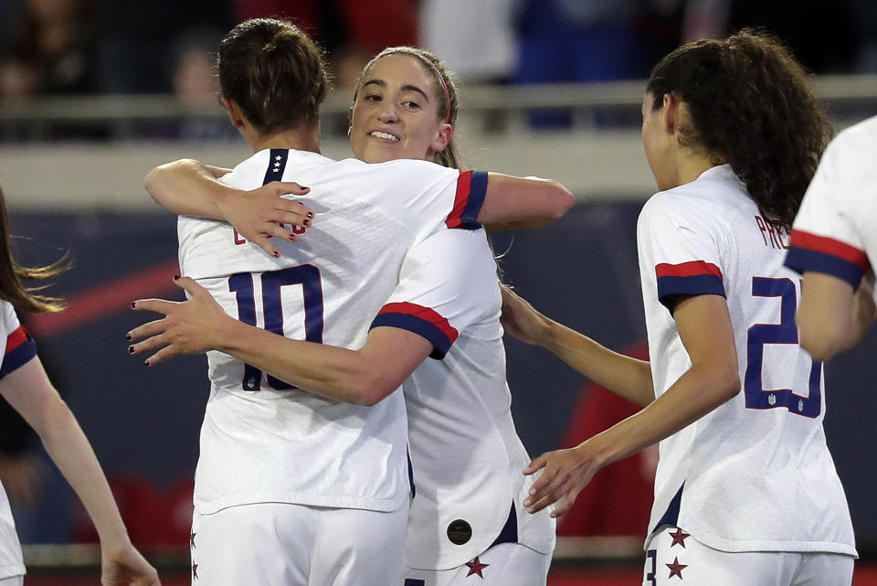 U.S. midfielder Morgan Brian, center, celebrates her goal against Costa Rica with forwards Carli Lloyd, left, and Christen Press, right, during the first half of an international friendly soccer match Sunday, Nov. 10, 2019, in Jacksonville, Fla. (AP Photo/John Raoux)