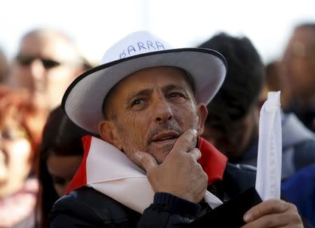 A protestor wears a Panama hat written on it during a demonstration calling on Maltese Prime Minister Joseph Muscat to resign after two members of his government were named in the Panama Papers leak scandal, outside the office of the Prime Minister in Valletta, Malta, April 10, 2016. REUTERS/Darrin Zammit Lupi