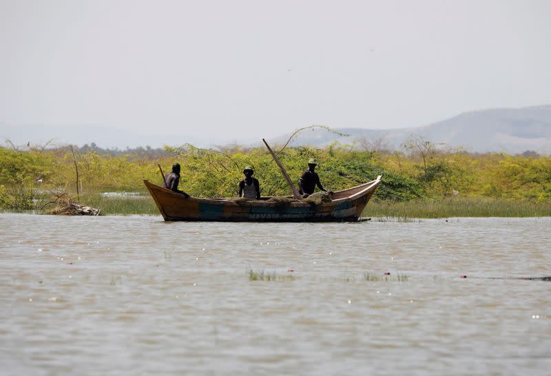 Fishermen are seen on a boat at Lake Turkana, near the town of Kalokol, Turkana county