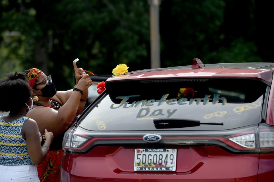 Victoria Blue of Crisfield, Maryland, said the holiday of Juneteenth has always had deep meaning for her, something she celebrates every year — but this year "with everything going on, I really wanted to be a part of it," she said, prepping her car for a Juneteenth caravan in Salisbury, Maryland, on June 19, 2020.