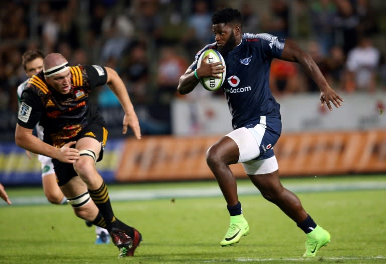 Northern Bulls' Jamba Ulengo (right) escapes from the Waikato Chiefs' Brodie Retallick during their Super Rugby clash in Hamilton, on April 1, 2017