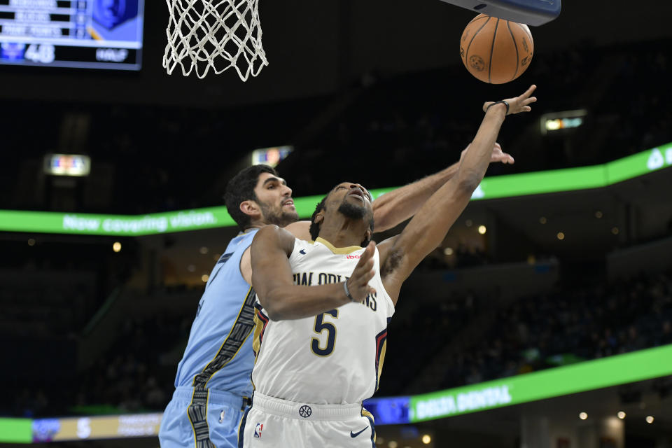 New Orleans Pelicans forward Herbert Jones (5) shoots ahead of Memphis Grizzlies forward Santi Aldama in the first half of an NBA basketball game, Monday, Feb. 12, 2024, in Memphis, Tenn. (AP Photo/Brandon Dill)