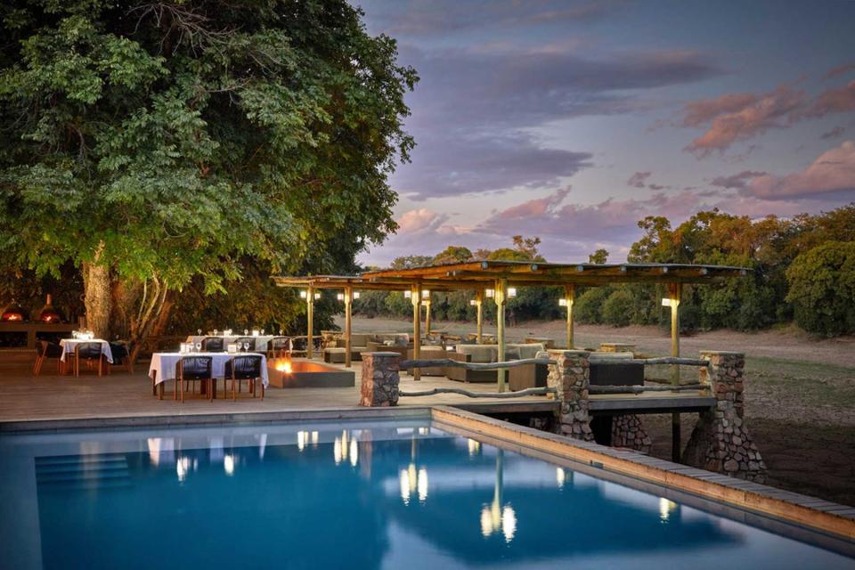 Pool and dining terrace at Bushcamp Company Mfuwe Lodge, voted one of the best Africa Safari Lodges