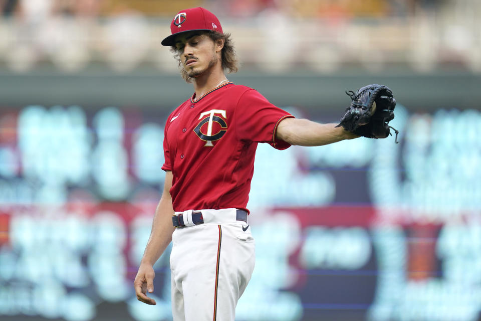 Minnesota Twins starting pitcher Joe Ryan reacts after giving up a two-run home run to Kansas City Royals' Vinnie Pasquantino during the first inning of a baseball game Monday, Aug. 15, 2022, in Minneapolis. (AP Photo/Abbie Parr)