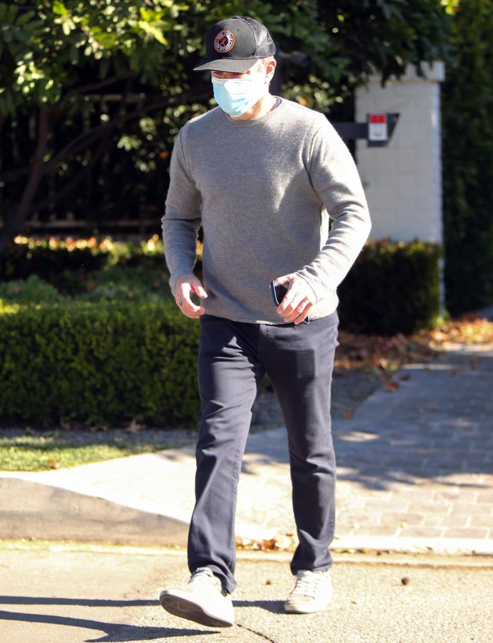 <p>A masked Matt Damon makes his way through Los Angeles on Wednesday.</p>