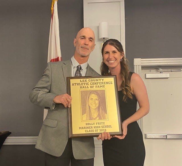 Holly Fritz (Sperry), a former soccer star at Marienr High School, was among eight members of the Lee County Athletic Conference Hall of Fame's Class of 2024. With her is her father Michael Fritz, who was also her youth soccer coach.