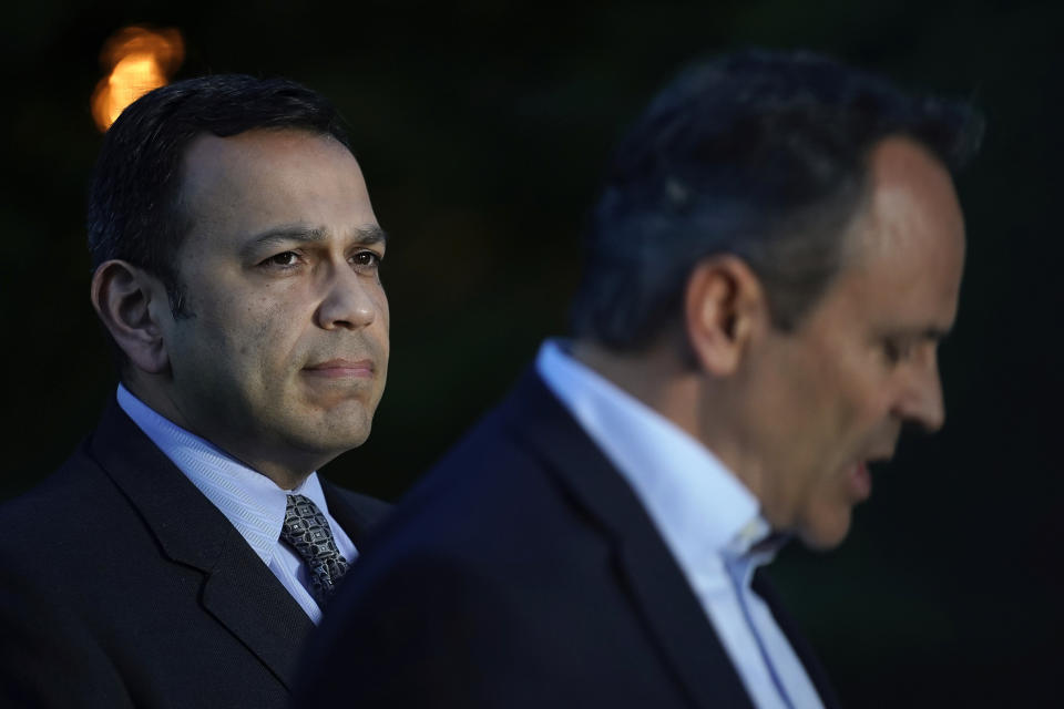 Kentucky Sen. Ralph Alvarado, left, the Republican nominee for lieutenant governor, stands with Kentucky Gov. Matt Bevin as the governor speaks to the media after winning the Republican gubernatorial primary, in Frankfort, Ky., Tuesday, May 21, 2019. (AP Photo/Bryan Woolston)