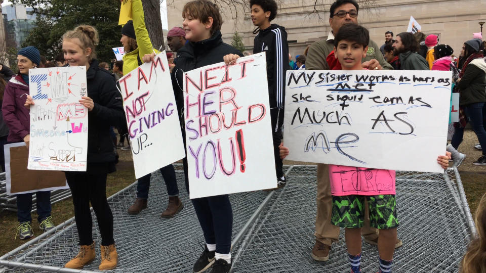 Children hold banners as they stand beside their parents in Washington D.C.&nbsp;