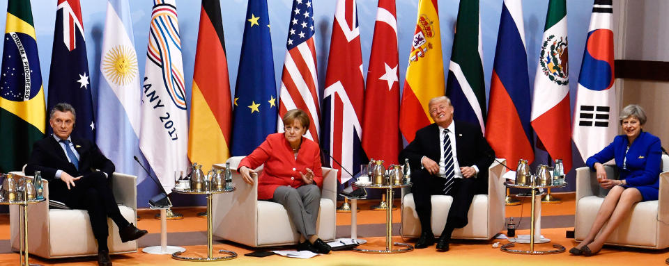 <p>From left: Argentina’s President Mauricio Macri, German Chancellor Angela Merkel, President Donald Trump and Britain’s Prime Minister Theresa May attend the “retreat meeting” on the first day of the G-20 summit in Hamburg, northern Germany, on Friday July 7, 2017. (Photo: John MacDougall/Pool Photo via AP) </p>