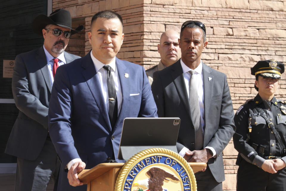 U.S. Attorney for the district of New Mexico Alexander Uballez, center, takes questions about the charges against a South Carolina man accused of killing a New Mexico state police officer, during a news conference In Albuquerque, N.M., on Friday, March 22, 2024. The defendant, Jeremy Smith, made his initial appearance in court on Friday and was placed in federal custody. (AP Photo/Susan Montoya Bryan)