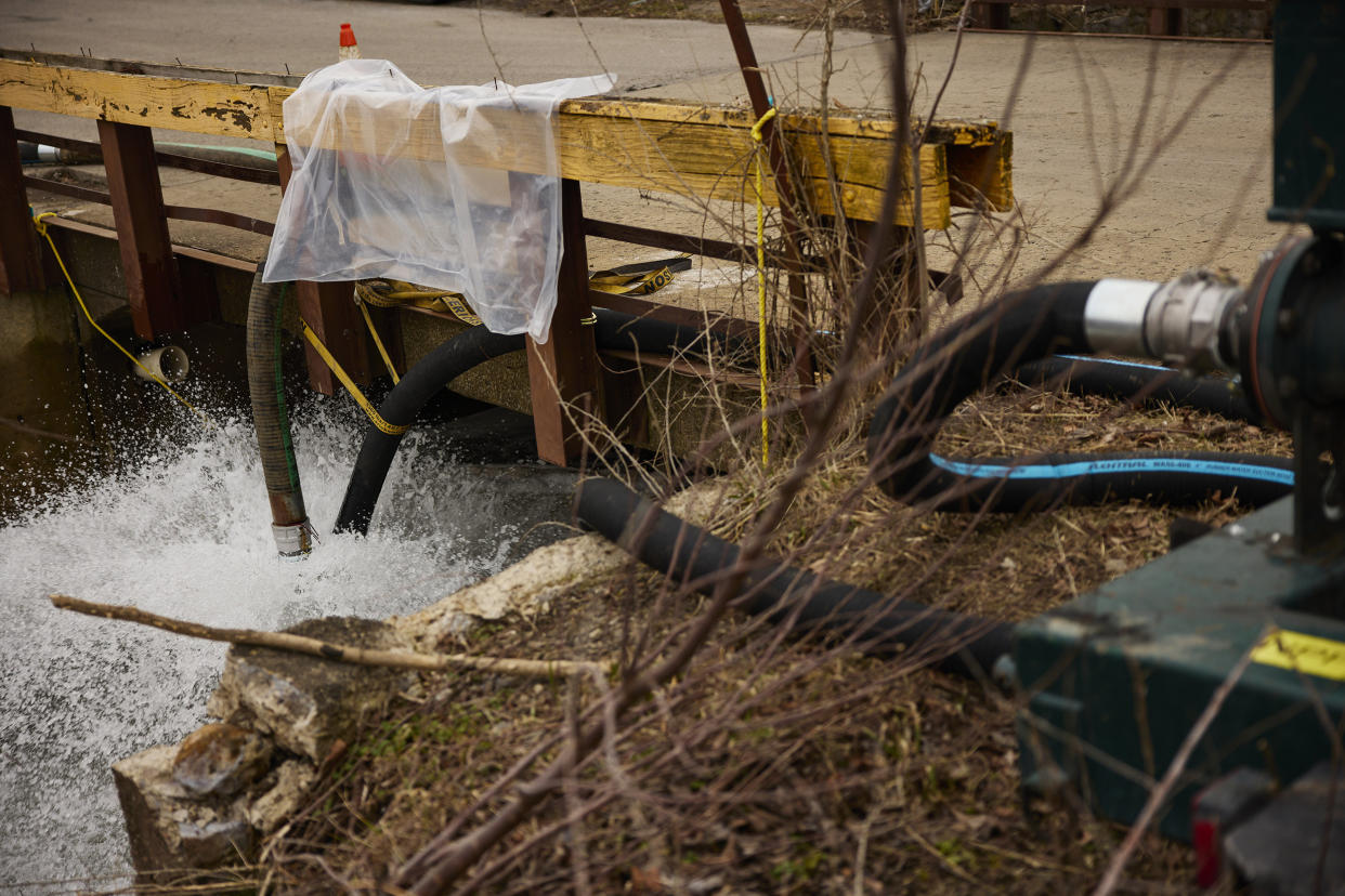 Water is pumped into a creek for aeration on Feb. 14, 2023 in East Palestine, Ohio. (Angelo Merendino / Getty Images)