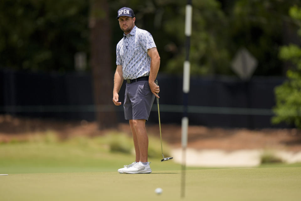 Colin Prater watches his putt on the first hole during a practice round for the U.S. Open golf tournament Wednesday, June 12, 2024, in Pinehurst, N.C. (AP Photo/Frank Franklin II)
