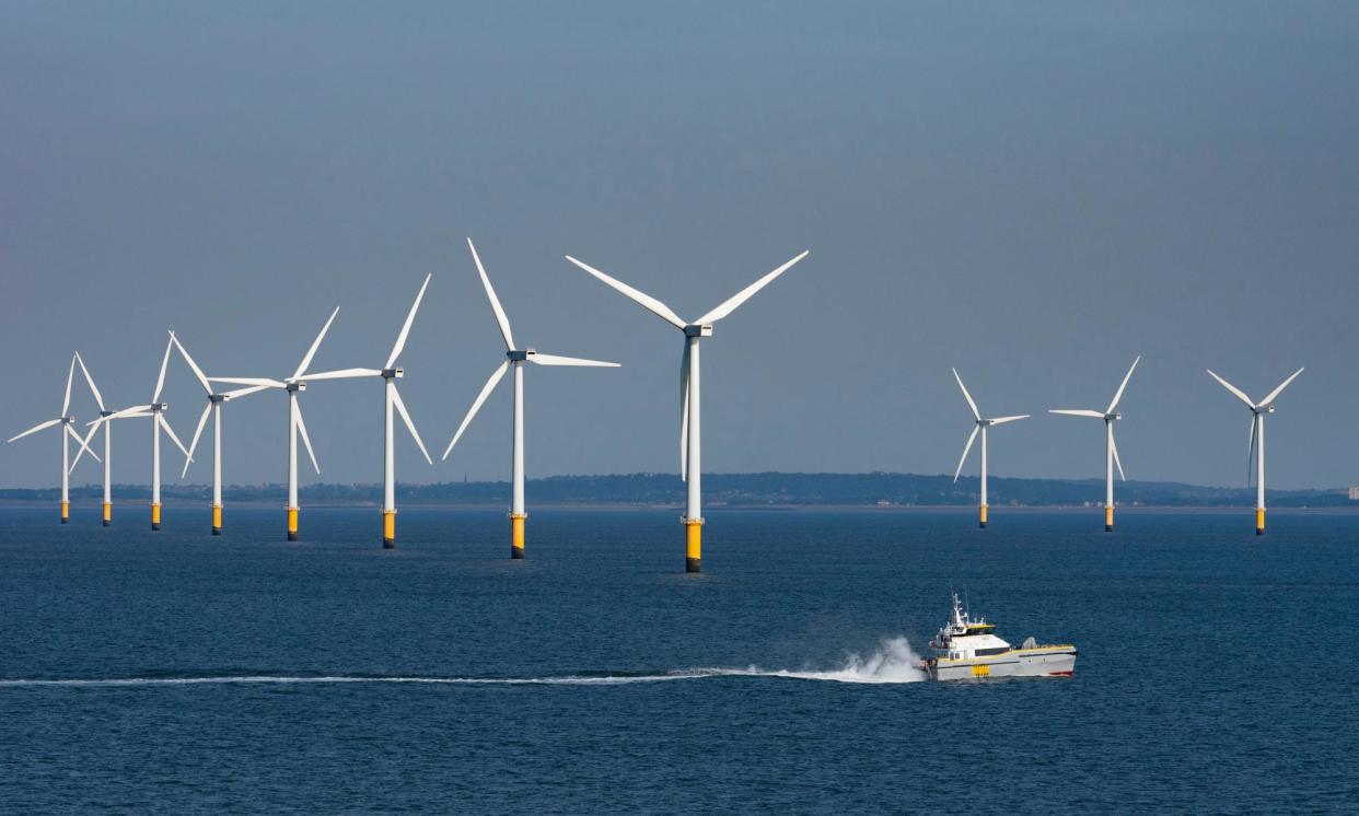 <span>Turbines at Burbo Bank in Liverpool Bay. Windfarms generated 7.04TWh in August, up more than 46% on the same month last year.</span><span>Photograph: UCG/Universal Images Group/Getty Images</span>