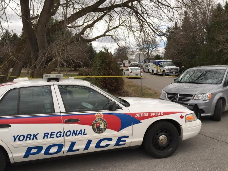 York Regional Police says it 'received information' around 10:45 a.m. Monday morning about a video in which a teenager — holding what looked like a firearm — made threats. The guns in question later turned out to be fake. (Greg Ross/CBC - image credit)