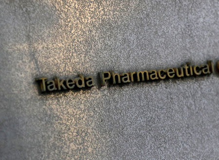 FILE PHOTO: Takeda Pharmaceutical's signboard is seen on its headquarters building in Tokyo, Japan January 30, 2018. REUTERS/Kim Kyung-Hoon/File Photo