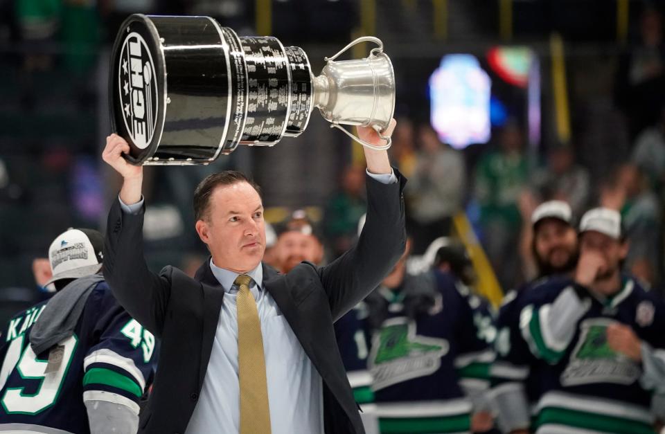 The Florida Everblades coach Brad Ralph lifts the Kelly Cup after his team defeated the Idaho Steelheads 4-3 in game four of the ECHL Kelly Cup to sweep the series at Hertz Arena in Estero on Friday, June 9, 2023. The team has now won back-to-back cups.