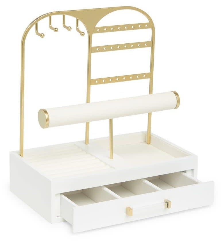 the white jewelry stand with gold accents