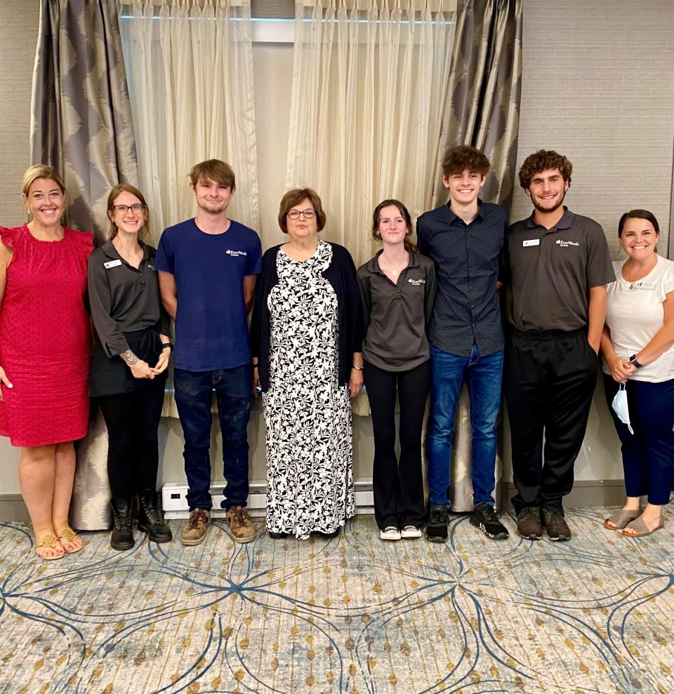 Some of the nine recipents of Senior Celebration Fund scholarships stand with Sandy Zunz, whose donation is funding the scholarship program for the next five years.