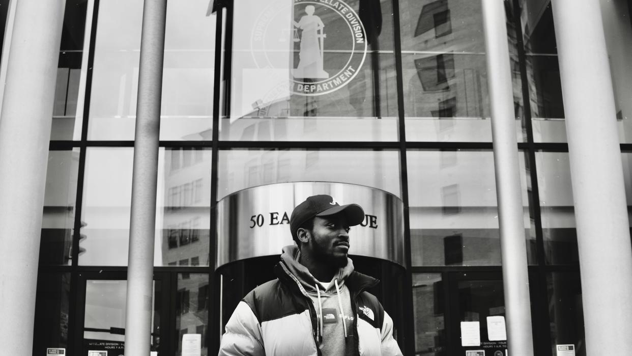 Anthony Miller stands in front of the Appellate Division, Fourth Department. On Nov. 13, 2020, 17 days after the Appellate Division, Fourth Department heard an oral argument, they decided on Anthony's case. Four days later, Anthony Miller was a free man.