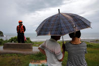 <p>A coast guard stands guard at the coast as Typhoon Malakas approaches in Yilan, Taiwan Sept. 17, 2016. (Photo: Tyrone Siu/Reuters) </p>