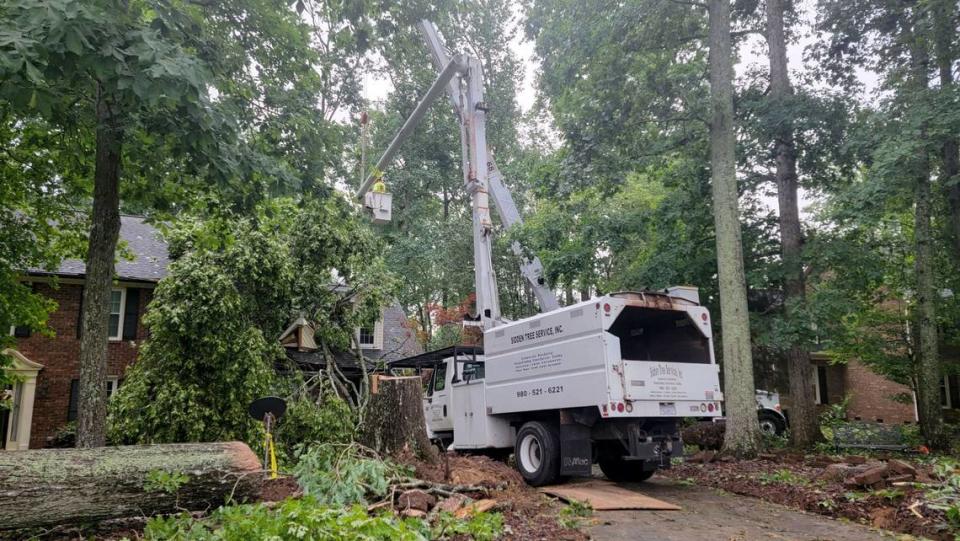 Crews are clearing a downed tree that was on Scottie Wold’s home in the Camelot neighborhood in Harrisburg, NC, on Tuesday morning. Wold wasn’t home when it happened, and she said no one in the neighborhood has a scratch on them.