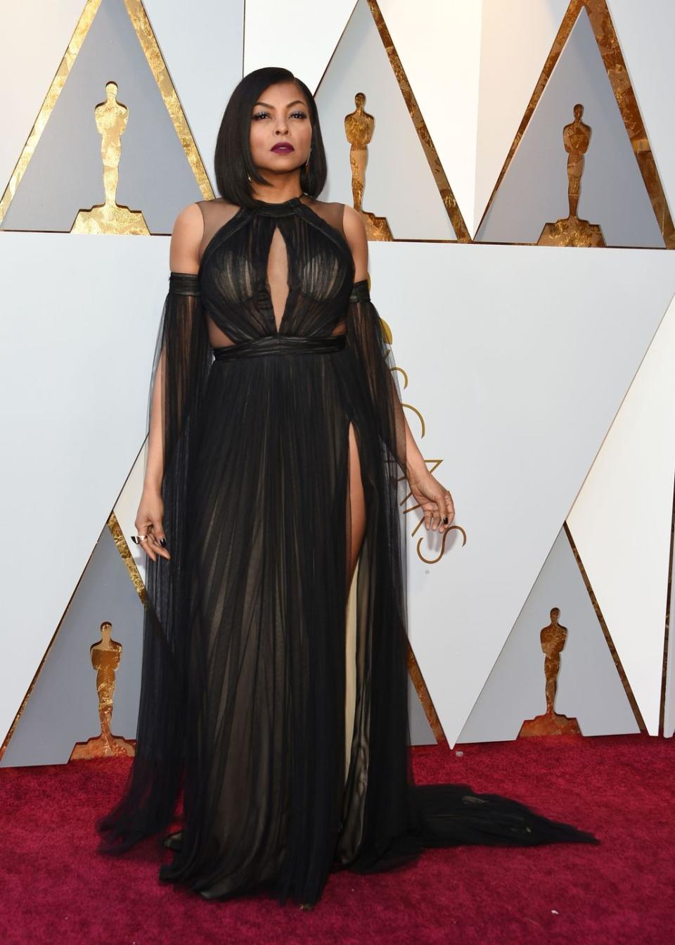 <p>Taraji looked like a goddess in a transparent gown. She was donned a flowy Vera Wang number with cutout details.</p>