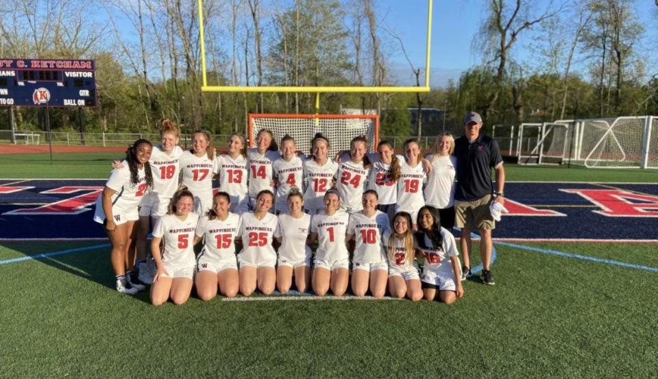 The Wappingers girls lacrosse team poses on its home field after defeating Pawling to win its first league title on May 11, 2022.