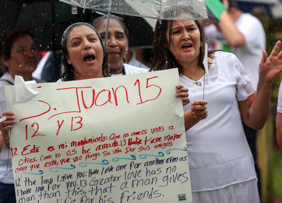 Demonstrators opposing Senate Bill 1718, a new immigration law pushed by Gov. Ron DeSantis, gather at Riverside Park in Vero Beach to rally on Thursday, June 1, 2023. The demonstration, organized by leaders of the Ministerio Cristiano Oasis de Bendicion, a church in Indian River County, voiced their concerns with the bill, which takes effect July 1. The group marched on Merrill P. Barber Bridge’s southern sidewalk waving to vehicles, with some honking in support.