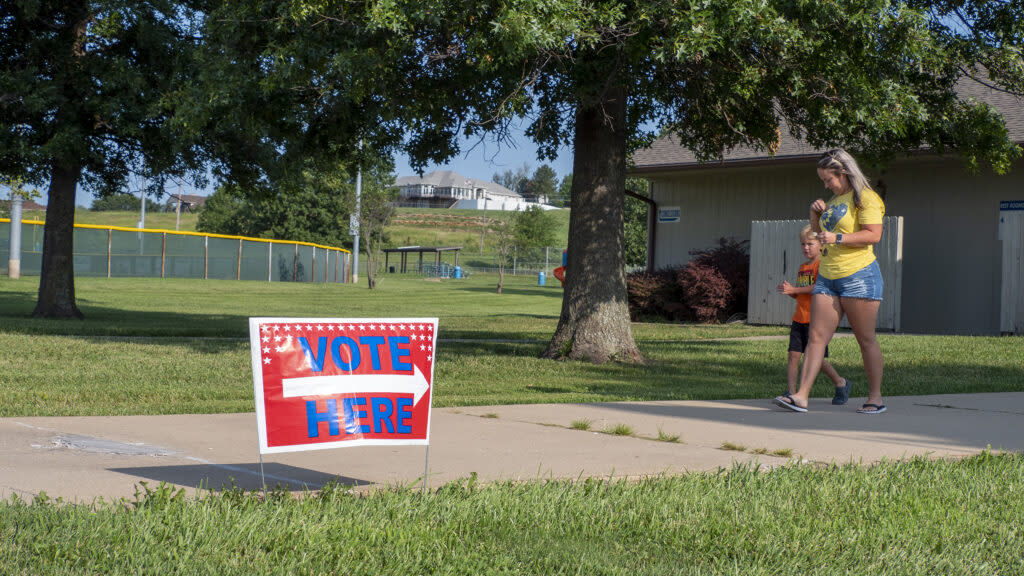 A voter leaves the polling place at the Sunrise Optimist Club north of Topeka. (Sherman Smith/Kansas Reflector)