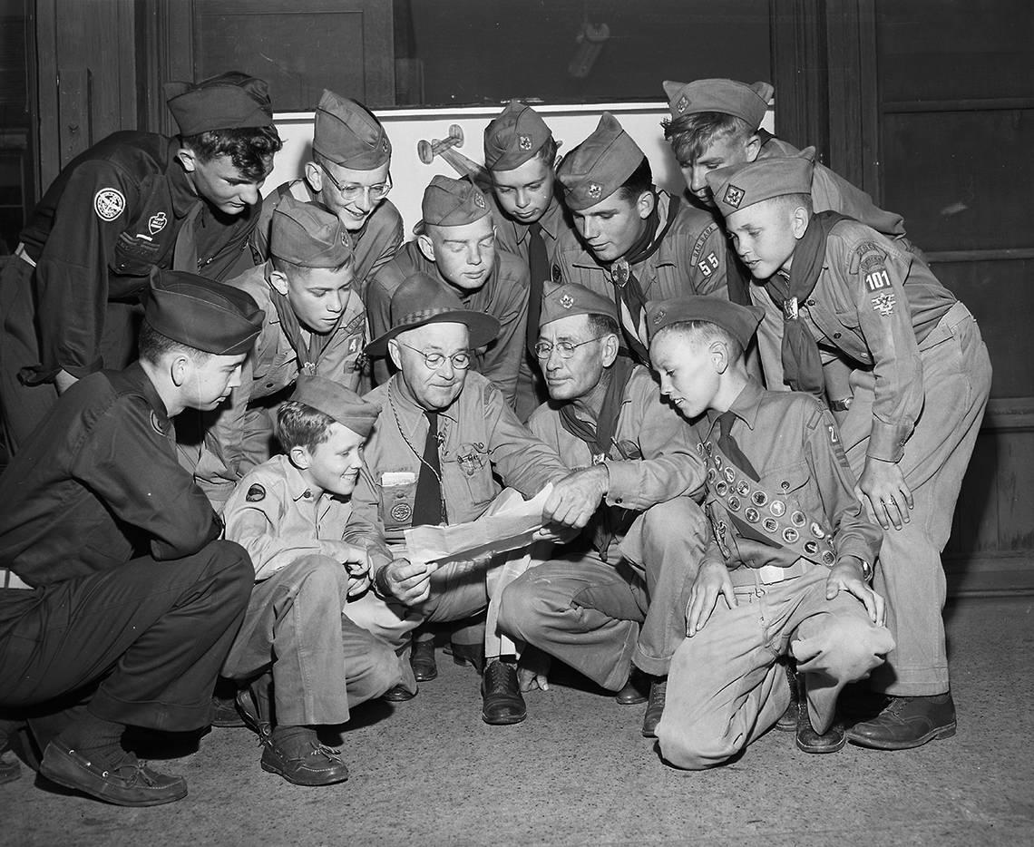 June 24, 1950: Headed for Valley Forge and National Boy Scout Jamboree, these District 9 scouts and leaders from eight Southwest and West Texas counties stopped in Fort Worth for breakfast. Crouching left to right, Joe Paul Tupin, Comanche; Jerry Shugart, Stephenville; C. L. Pouncey, Brownwood, scoutmaster of Jamboree Troop Number 26; Lee R. Teason, Richland Springs, scoutmaster of Troop Number 27, and Clyde Mathews, Bangs. Standing, left to right, Arlie Merlin McAnelly Brown, Stephenville; Ray Hudson and Lathon Jernigan, both of Goldthwaite; Merlin McAnelly and Travis Herring, both of Lometa; Tony Kirk, San Saba; David Masner, Breckenridge, and Puddy Deen, Cisco. Fort Worth Star-Telegram archive/UT Arlington Special Collections