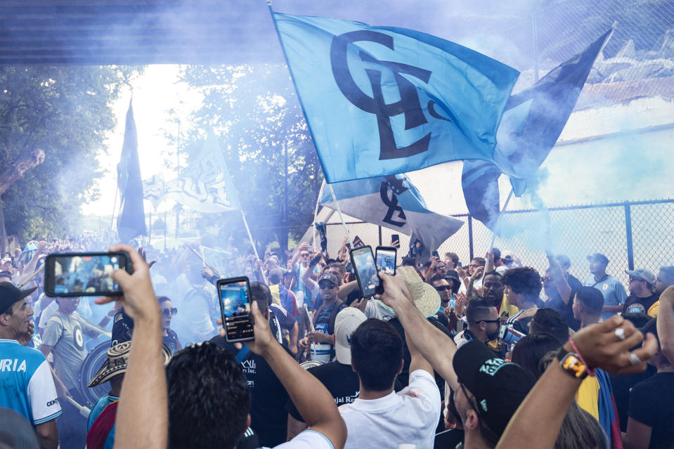 Fans gather and cheer prior to an MLS soccer match between Charlotte FC and Toronto FC, Saturday, Aug. 27, 2022, in Charlotte, N.C. (AP Photo/Matt Kelley)