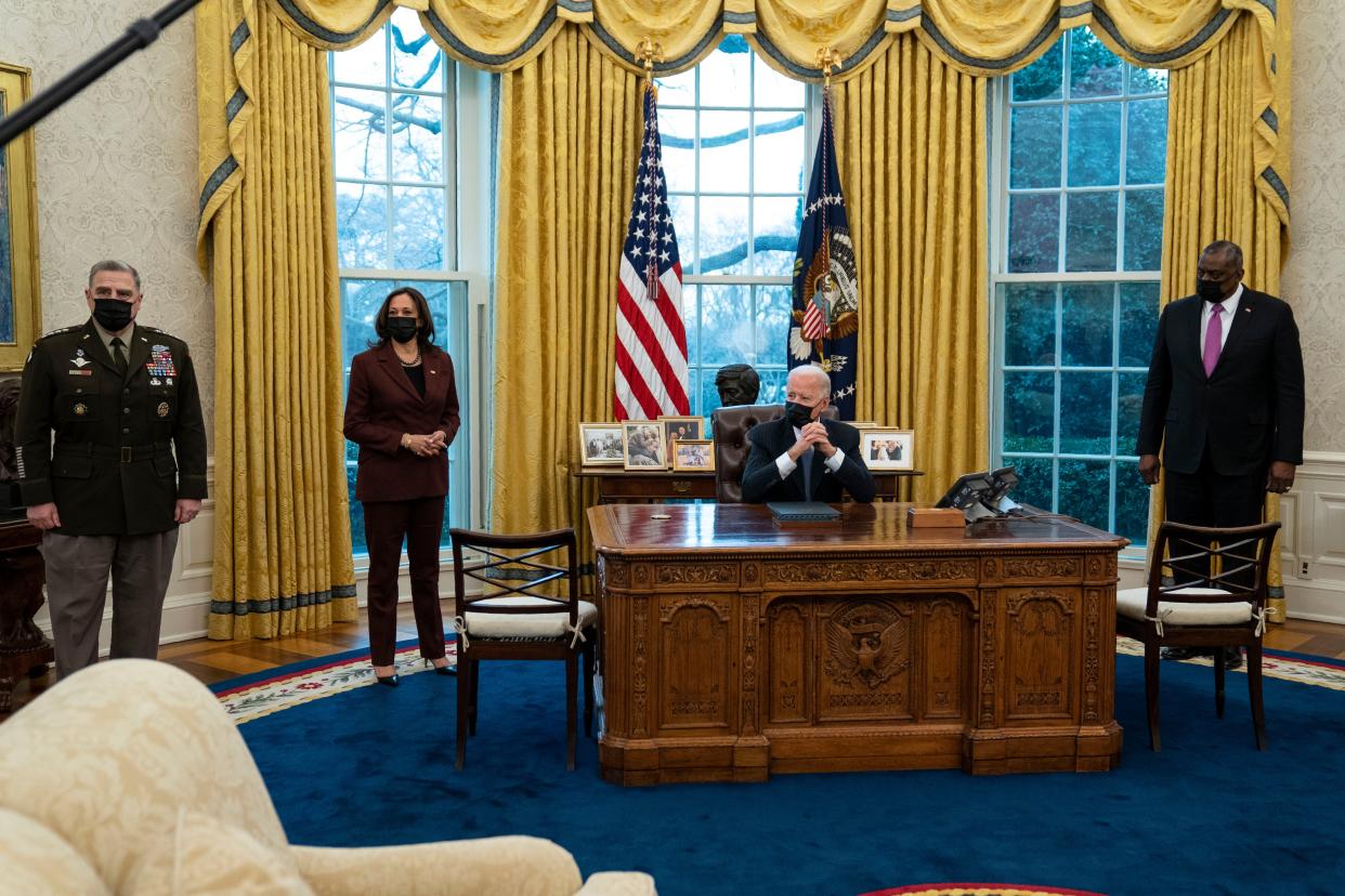 President Joe Biden meets with, from left, Chairman of the Joint Chiefs of Staff Mark Milley, Vice President Kamala Harris and Secretary of Defense Lloyd Austin, in the Oval Office of the White House, Monday, Jan. 25, 2021, in Washington.