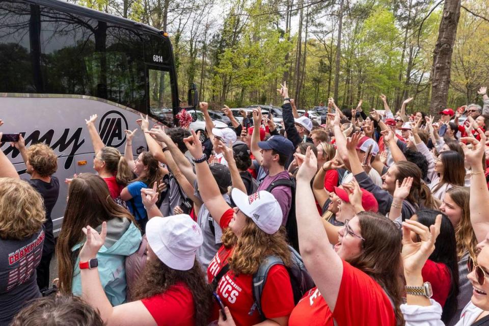 NC.State fans cheer as a bus carrying the men’s basketball team departs campus Wednesday, April 3, 2024. The team is headed to the Final Four for the first time since 1983. Travis Long/tlong@newsobserver.com