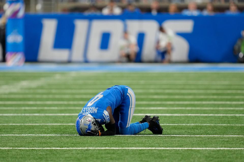 Detroit Lions cornerback Emmanuel Moseley lies on the turf after being injured in the first half against the Carolina Panthers at Ford Field, Sunday, Oct. 8, 2023.