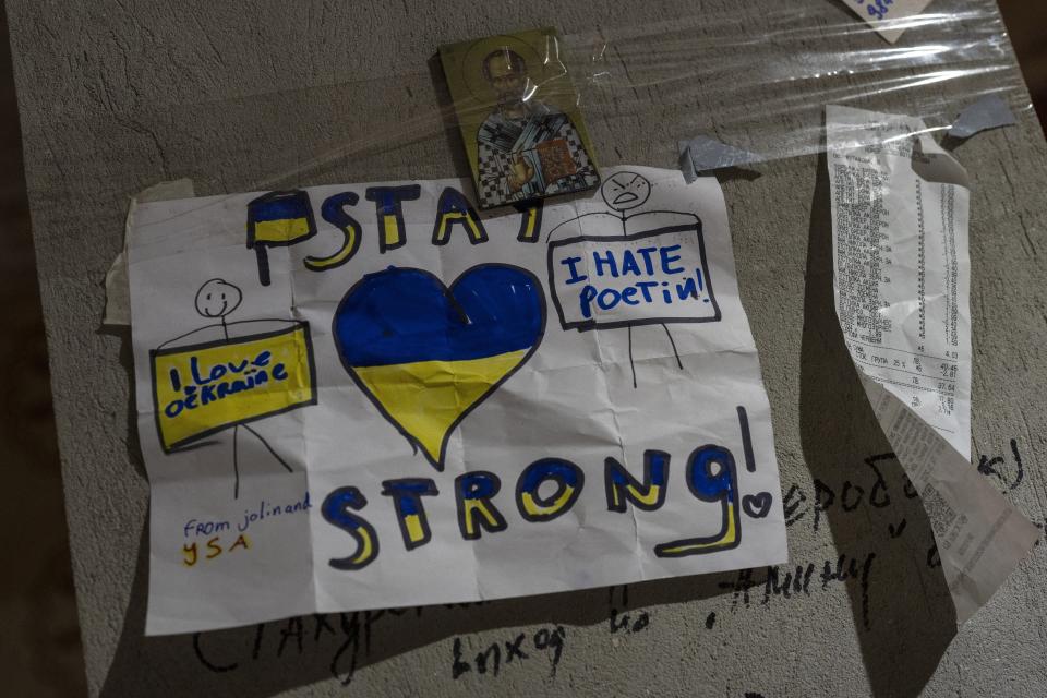 An icon is wrapped on a column of a building inside a Ukrainian volunteer center in Mykolaiv, Ukraine, on Monday, March 28, 2022. Ukrainian volunteers have set up a center to supply army and civilians with clothes, food, medicines and makeshift bullet proof vests. (AP Photo/Petros Giannakouris)