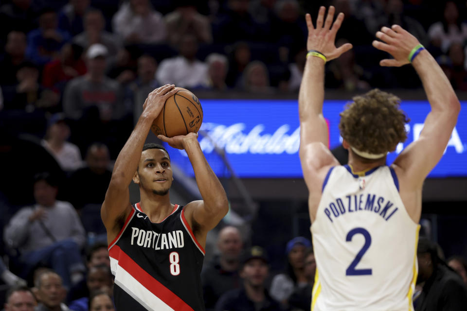 Portland Trail Blazers forward Kris Murray (8) shoots against Golden State Warriors guard Brandin Podziemski (2) during the first half of an NBA basketball game in San Francisco, Wednesday, Dec. 6, 2023. (AP Photo/Jed Jacobsohn)