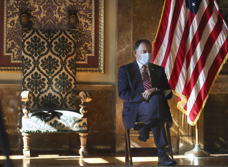 Gov. Gary Herbert listens as Gov.-elect Spencer Cox announces details related to their upcoming transition of leadership in the Gold Room at the Utah State Capitol on Thursday, Nov. 5, 2020, in Salt Lake City. Cox, who won the governor's race this week, said he is prepared to continue the fight against COVID-19 when he succeeds Herbert in January. He said he hopes to focus on ramping up testing, adding more contact tracers and implementing vaccine distribution. (Steve Griffin/Deseret News, via AP, Pool)